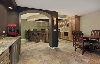 lower level basement with bar and chairs